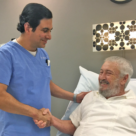 Dr. Gupta with patient